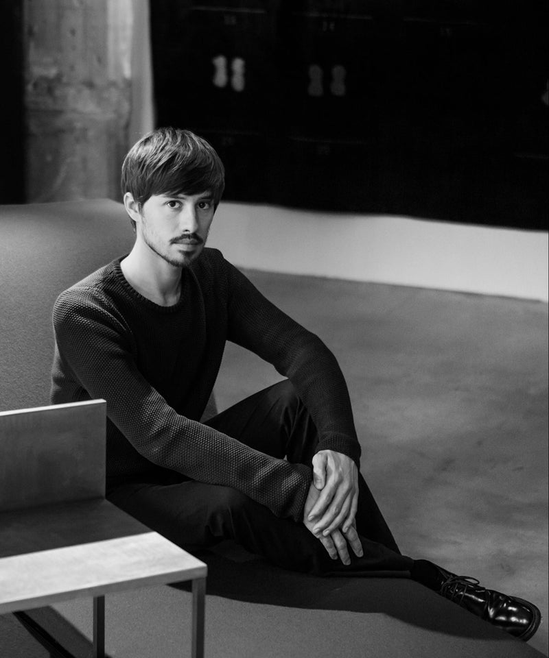 Federico Peri sitting on a sofa