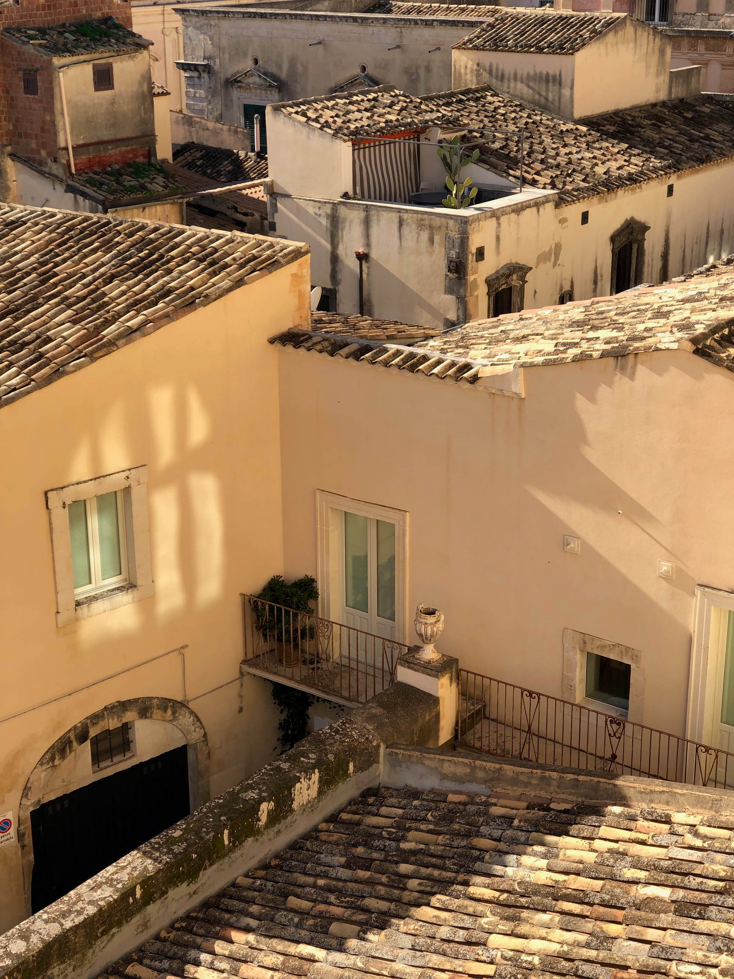Traditional Mediterranean architecture with terracotta roofs and white walls.