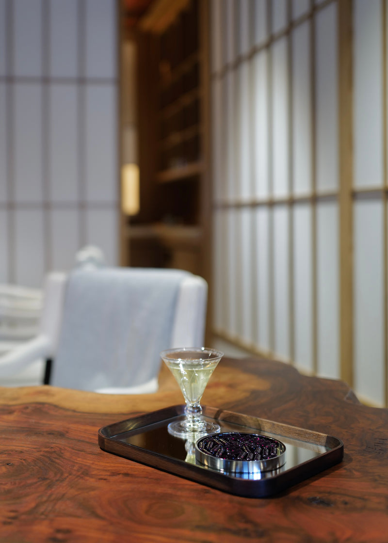 This image shows chiaroscuro, the design object designed to elevate the daily practice of taking vitamins. Situated within a beautiful Kyoto room designed by Tony Chi. Here the container is open and you can see the food supplement vitamin D capsules. 