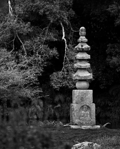 Stone pagoda in a forest setting