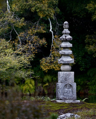 Stone pagoda in a forest setting